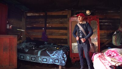 a man is standing in front of a room