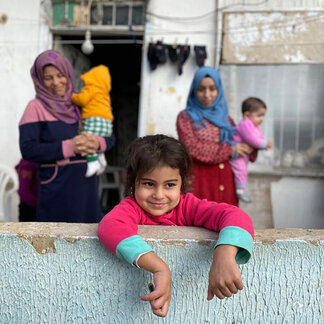 A family in front of their house
